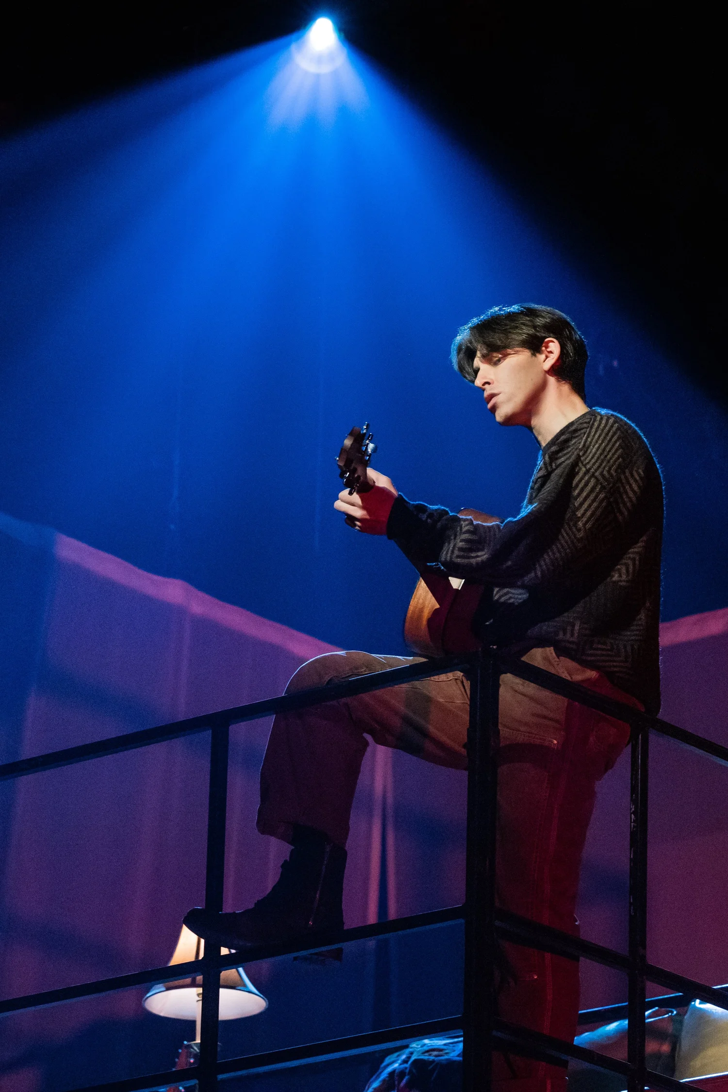 Matt Rodin performing as Roger in Rent at Paper Mill Playhouse