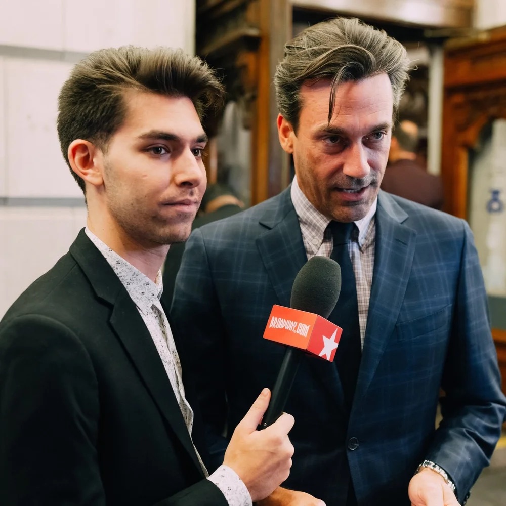 Matt Rodin interviewing Jon Hamm on a Broadway red carpet